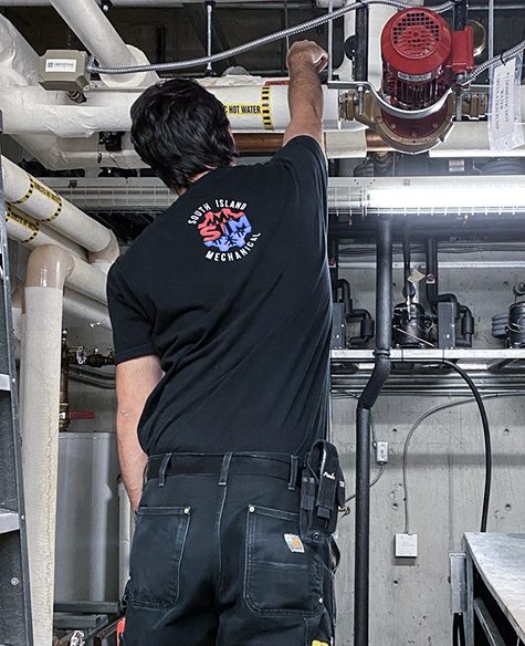 HVAC staff working on HVAC system